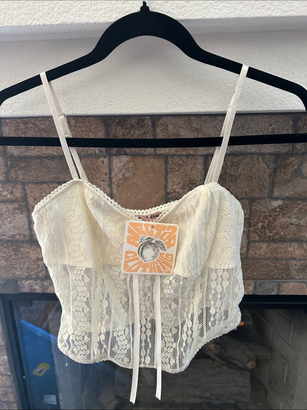 Bailey Rose lace tie-front camisole top
With adjustable spaghetti straps